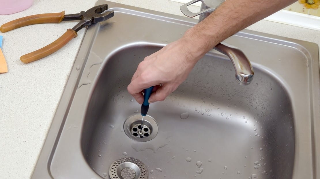 Technician Repairing Kitchen Sink Drain