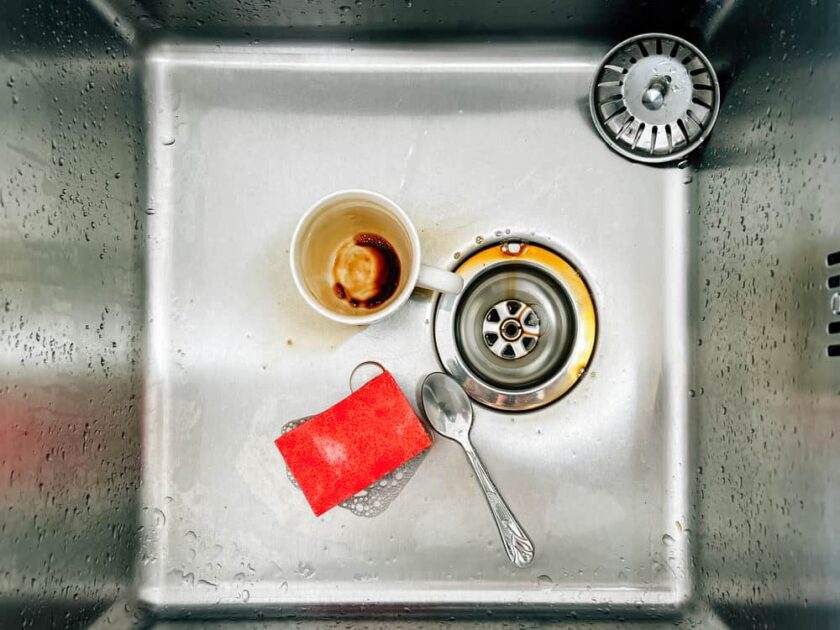 sponge coffee cup and a tea sfreshpoon in kitchen sink
